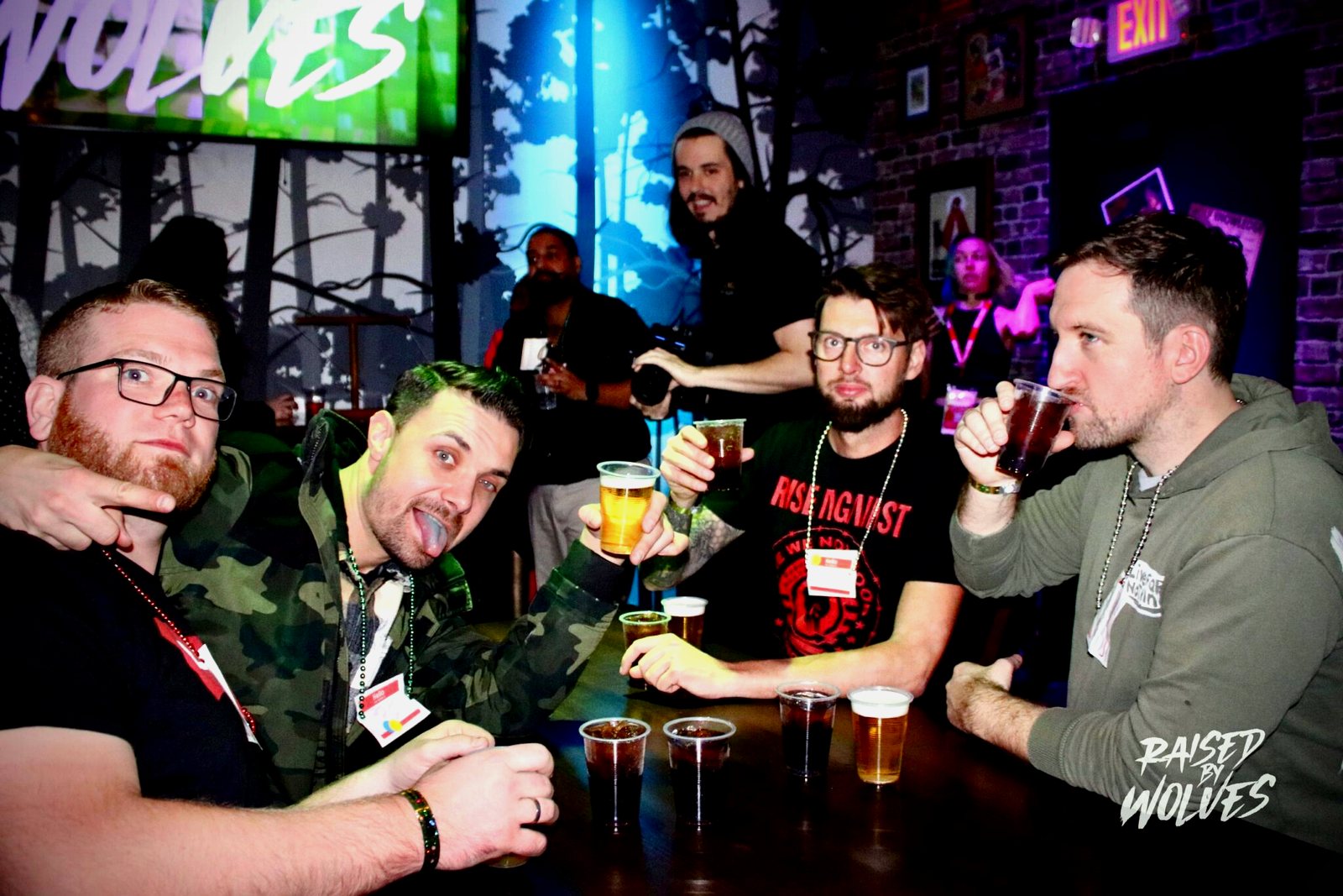 Group cheers with open bar drinks at Raised By Wolves Fremont Street Las Vegas
