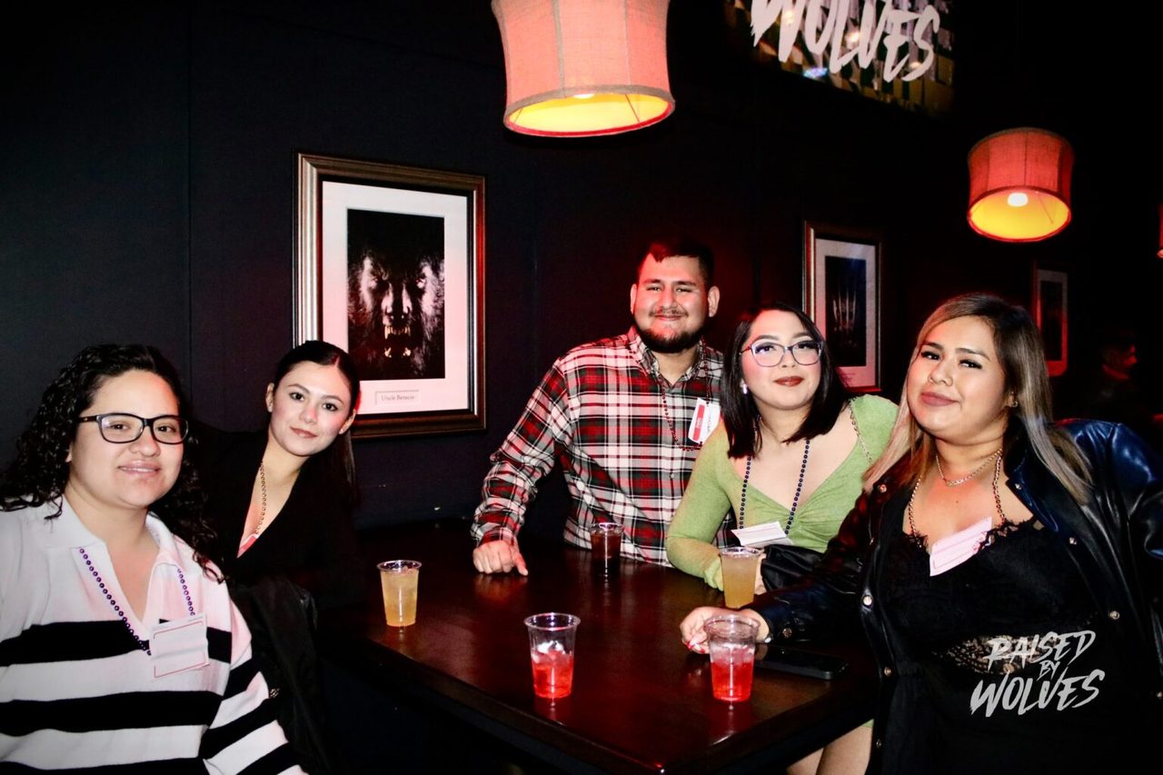 Group at a reserved booth with drinks at Raised By Wolves Downtown Las Vegas